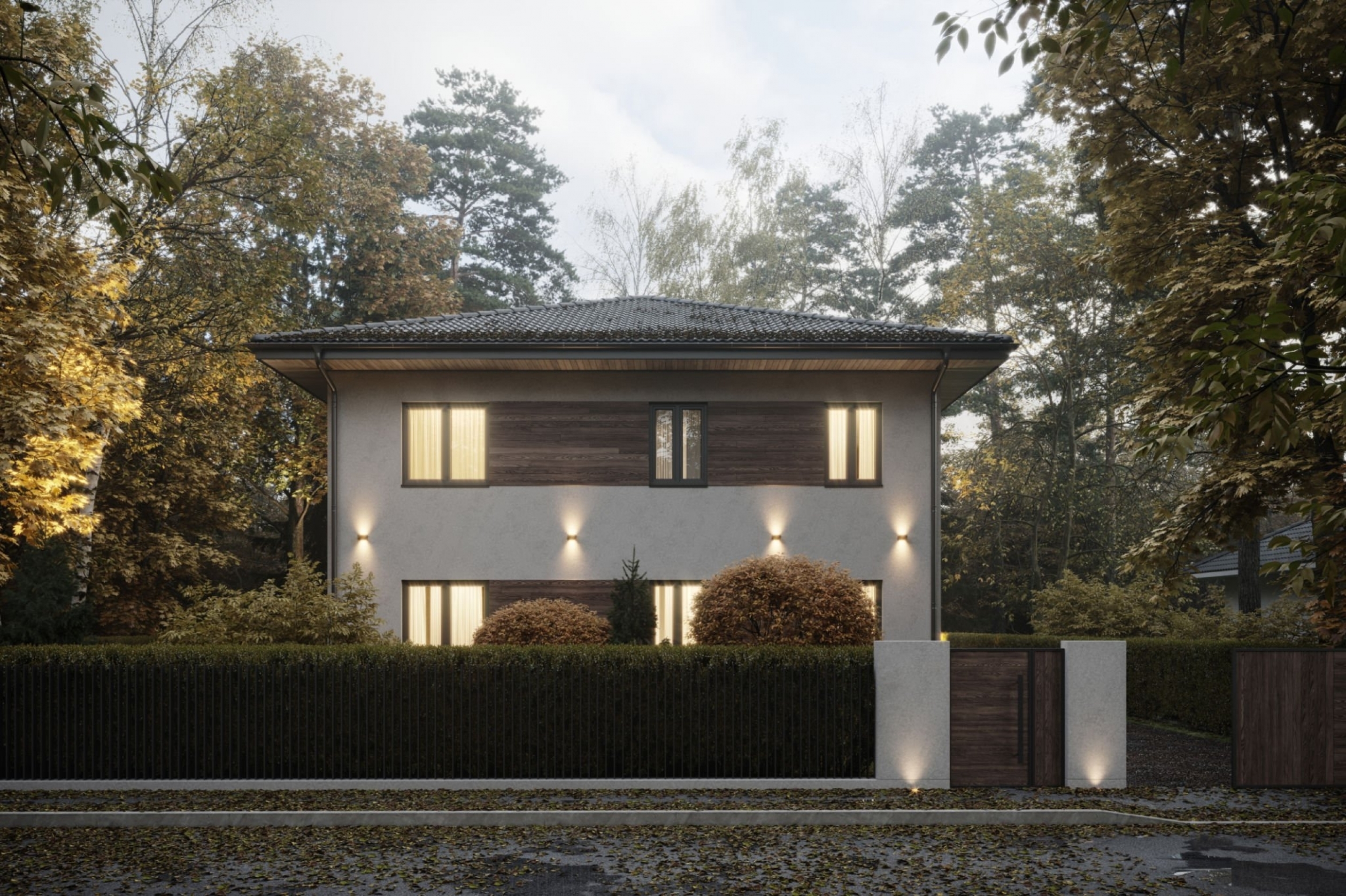 House exterior at dusk with warm lit windows